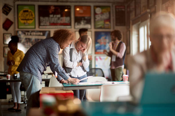 istock Young colleagues in a working atmosphere in the office 1385527689
