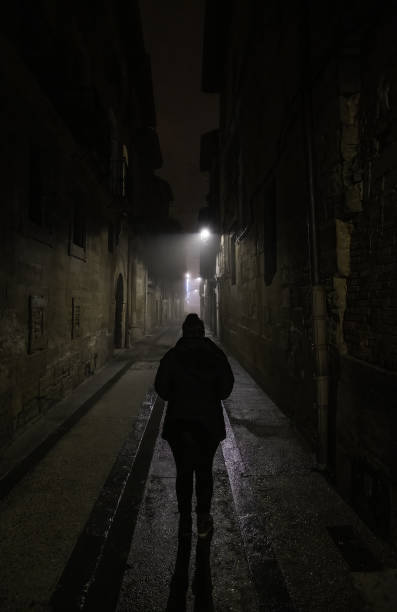 Woman in dark street