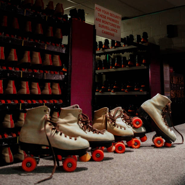 Blank black and white roller skates mockup pair on tiptoe, 3d rendering. Empty disco skating shoe mock up set, isolated, half-turned view. Clear old-fashioned rollerskates for rink racing template.