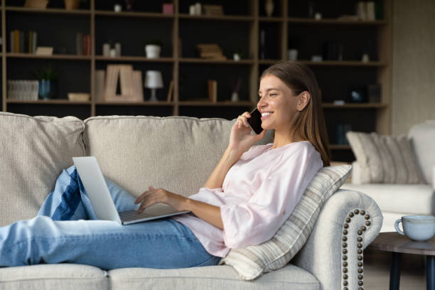 istock Depressed young woman sitting on windowsill, feeling lonely on holidays. 1385530443