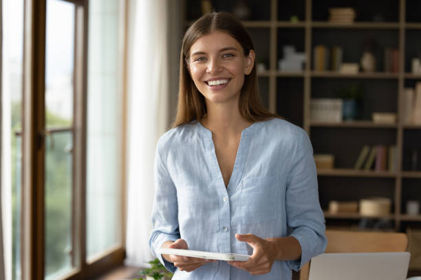istock Euphoric young woman celebrating internet success at home. 1385531579