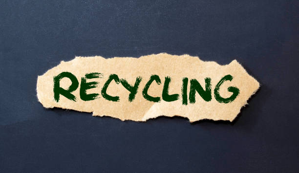 istock Recyclable packaging text on craft paper bag. Recycled pack. 1385532838