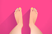 istock Legs of woman and colorful nails, pedicure and foot care 1385537687