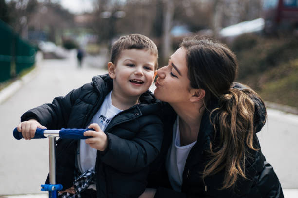 istock Mother and son spending time together outside 1385537843