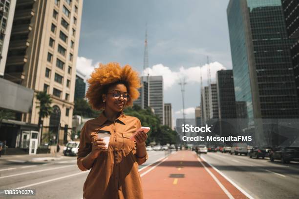 Afro Woman Using Smartphone On Avenida Paulista Stock Photo - Download Image Now - São Paulo, São Paulo State, One Woman Only