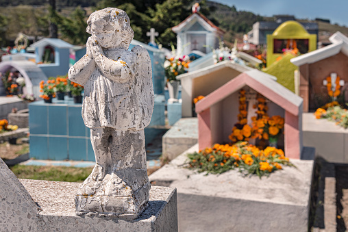 Little angels on top of graces in the Day of the Dead in Mexico