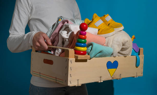 Donation box with children's things and toys for Ukrainian refugees. stock photo