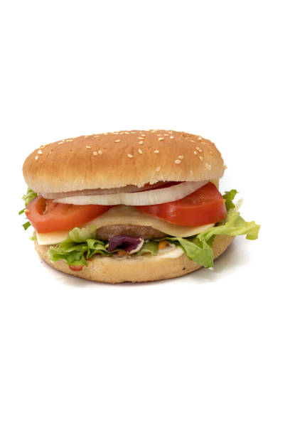 istock A hamburger, with the ingredients, lettuce, cabbage, cucumber, tomato, onion, cheese, ketchup, mayonnaise 1385544327