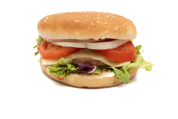 istock A hamburger, with the ingredients, lettuce, cabbage, cucumber, tomato, onion, cheese, ketchup, mayonnaise 1385544334