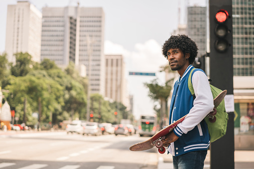 Man skateboarding on Avenida Paulista in Sao Paulo