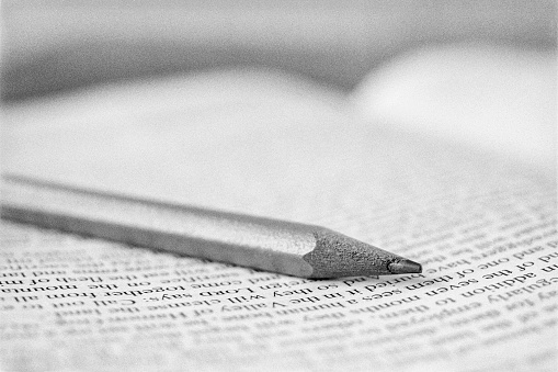 Pencil on open bible during a study
