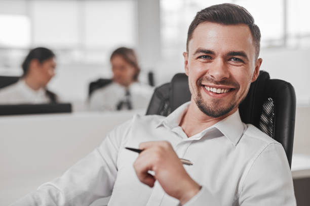 istock Positive male manager in office 1385568913