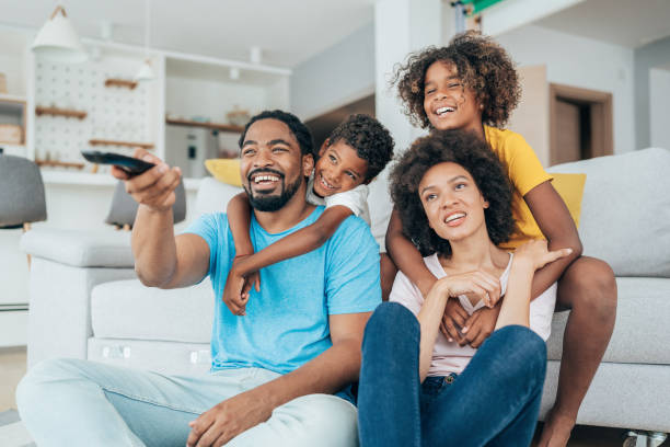 istock Family watching television 1385578588