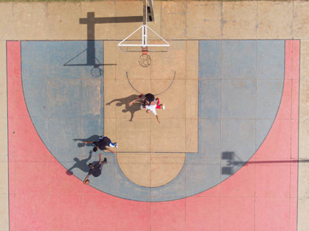 istock playing basketball in the park 1385581031