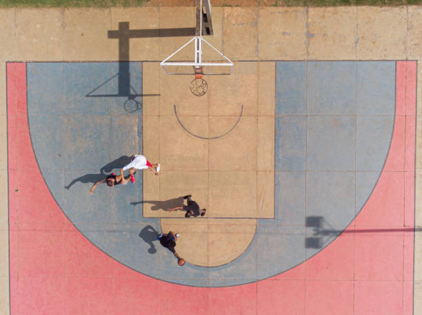 istock playing basketball in the park 1385581033