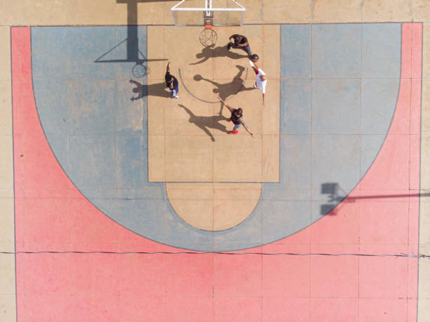 istock playing basketball in the park 1385581038