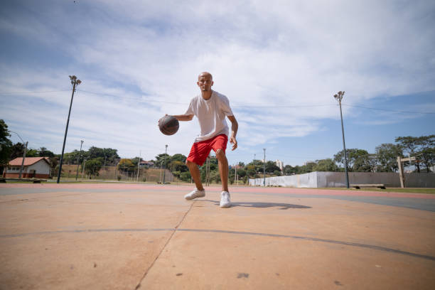 istock playing basketball in the park 1385581047