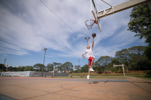 istock playing basketball in the park 1385581049