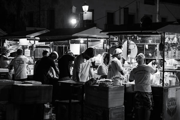 Olinda, Pernambuco, Brazil - march 12, 2022:People working in a food kiosk in Olinda