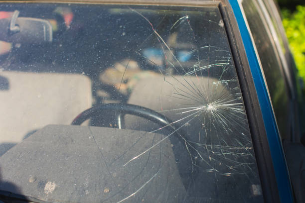 Old abandoned car. Broken windshield with cracks stock photo