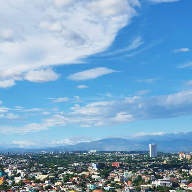 istock City view with clouds and mountains at Manhattan Cubao 1385598984