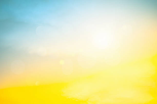 istock Relaxing outdoors vacation landscape concept: Abstract blurred sunlight beach colorful blurred bokeh background with retro effect autumn sunset sky have blue bright, white, and color orange calm. 1385601640