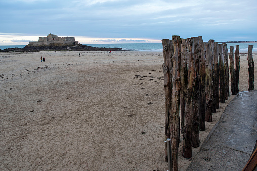Breakwater of Saint Malo on the beach in Brittany to protect the city from the waves