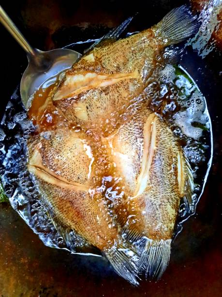 istock Frying Snakeskin Gourami Fish - Food preparation. 1385602598