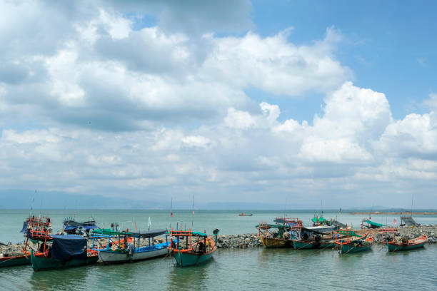 Fishing boats in Kep, Cambodia. Kep, Cambodia - February 2022: Fishing boats on Kep beach on February 15, 2022 in Kep, Cambodia. kep stock pictures, royalty-free photos & images