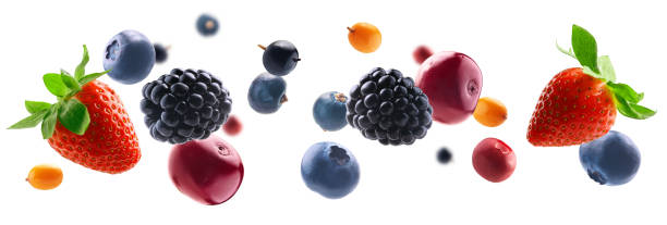 Many different berries in the form of a frame on a white background stock photo