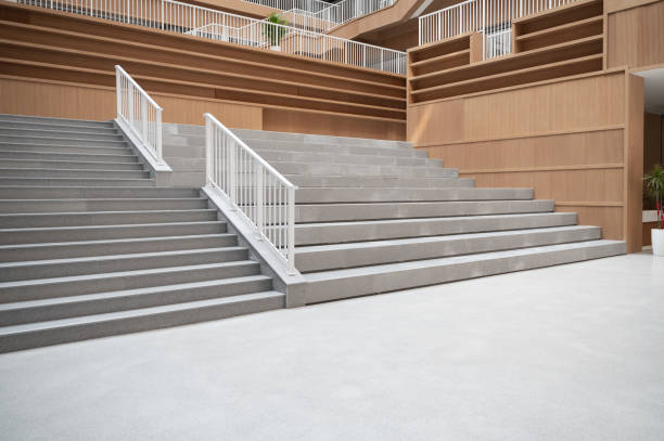 istock Staircases and empty bookshelves in a modern library. 1385608263