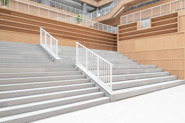 istock Staircases and empty bookshelves in a modern library. 1385608459