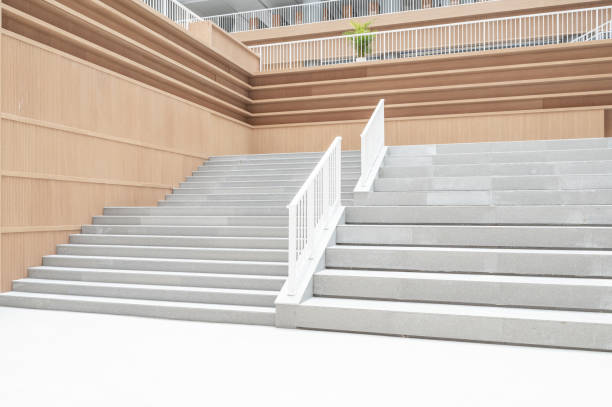 istock Staircases and empty bookshelves in a modern library. 1385608464