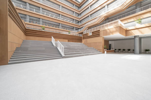 istock Staircases and empty bookshelves in a modern library. 1385609002