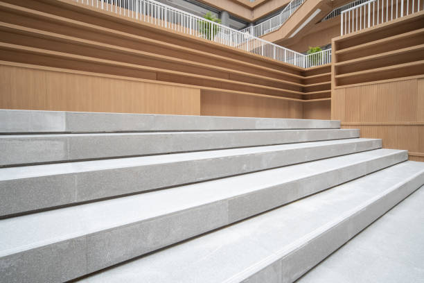 istock Staircases and empty bookshelves in a modern library. 1385609128