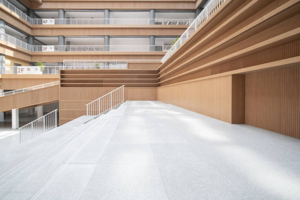 istock Staircases and empty bookshelves in a modern library. 1385609170