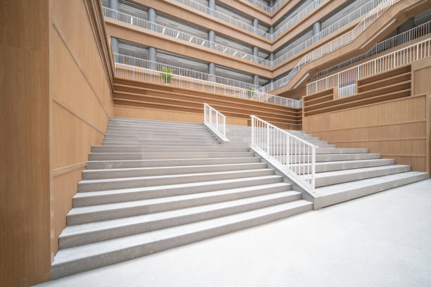 istock Staircases and empty bookshelves in a modern library. 1385609193