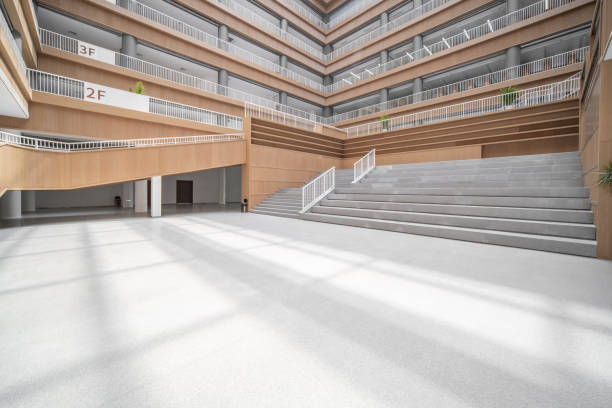 istock Staircases and empty bookshelves in a modern library. 1385609219
