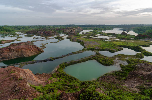 istock Quarry lake with different green and blue color view 1385609423