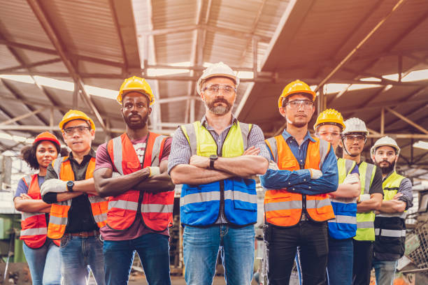 istock Group of Worker Engineer Teamwork people mix race in Heavy Industry standing confident.selective focus at center man 1385612229