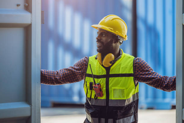 istock customs staff worker in port shipping opening checking goods in container box 1385612275