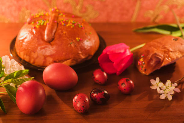 Close-up of Easter cake with icing, nuts and dried fruits. Selective focus.