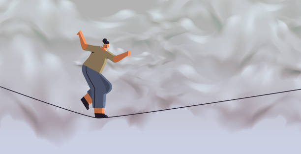 istock businesswoman walking on balancing tight rope risk challenge help in business concept 1385613124