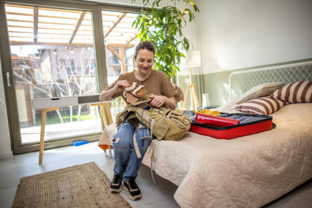 istock Woman packing for a vacation 1385616093