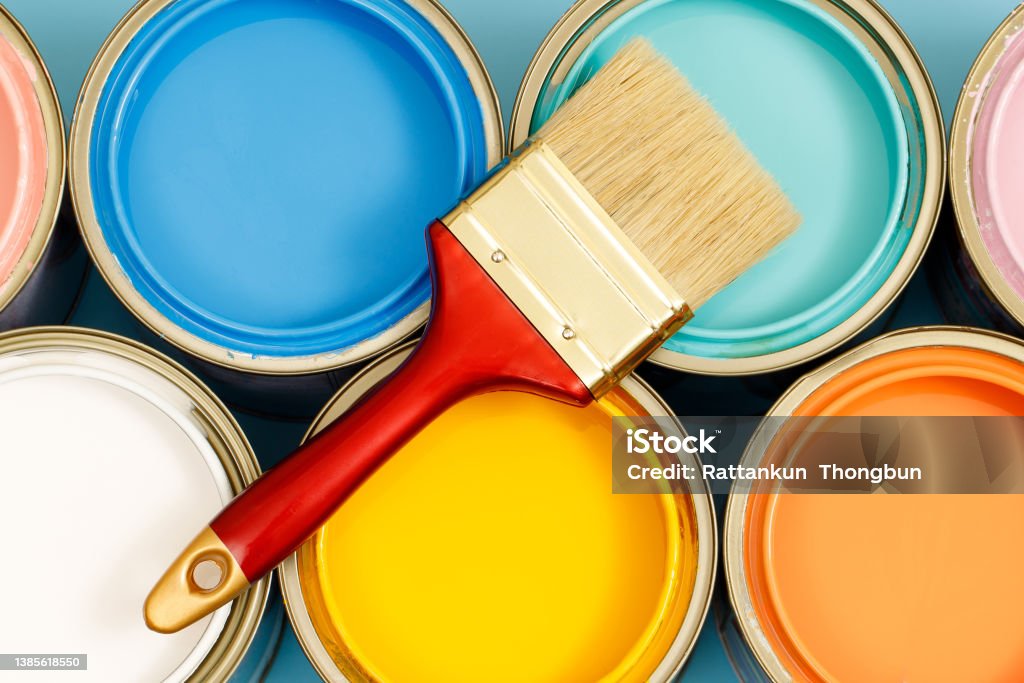 Paint cans and paint brushes and how to choose the perfect interior paint color and good for health Painting - Activity Stock Photo