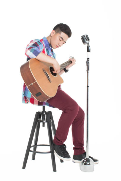 young chinese male singer, on white studio show