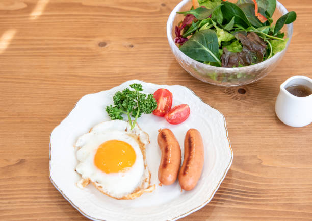 istock Half-boiled fried egg and sausage and toast morning set 1385619706