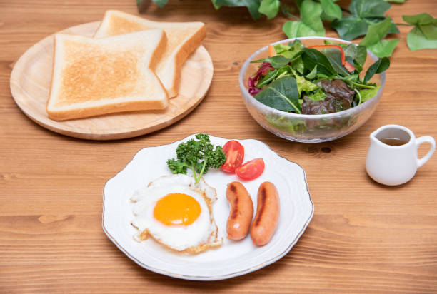 istock Half-boiled fried egg and sausage and toast morning set 1385619752