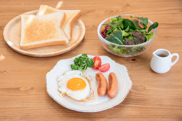 istock Half-boiled fried egg and sausage and toast morning set 1385619757