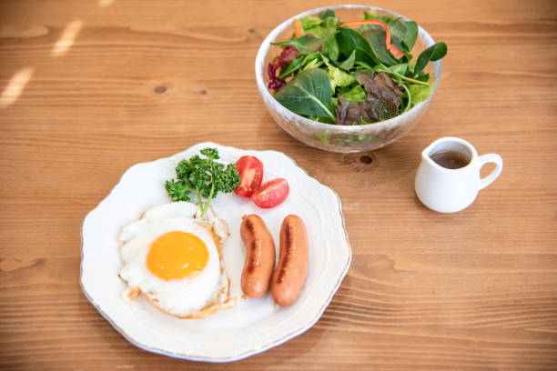 istock Half-boiled fried egg and sausage and toast morning set 1385619770